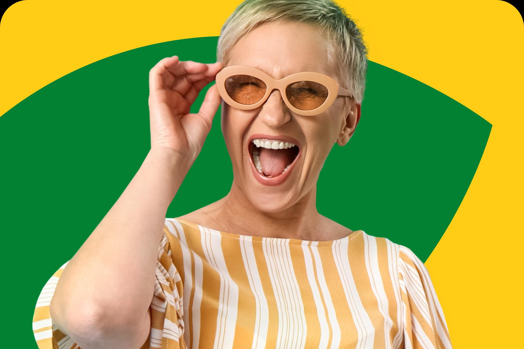 Image of an older woman smiling wearing sunglasses